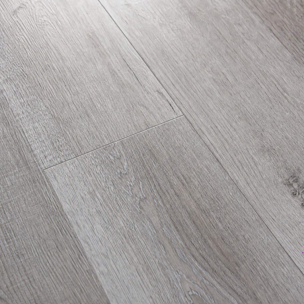 Close-up of gBamburgh Grey rigid LVT plank flooring.