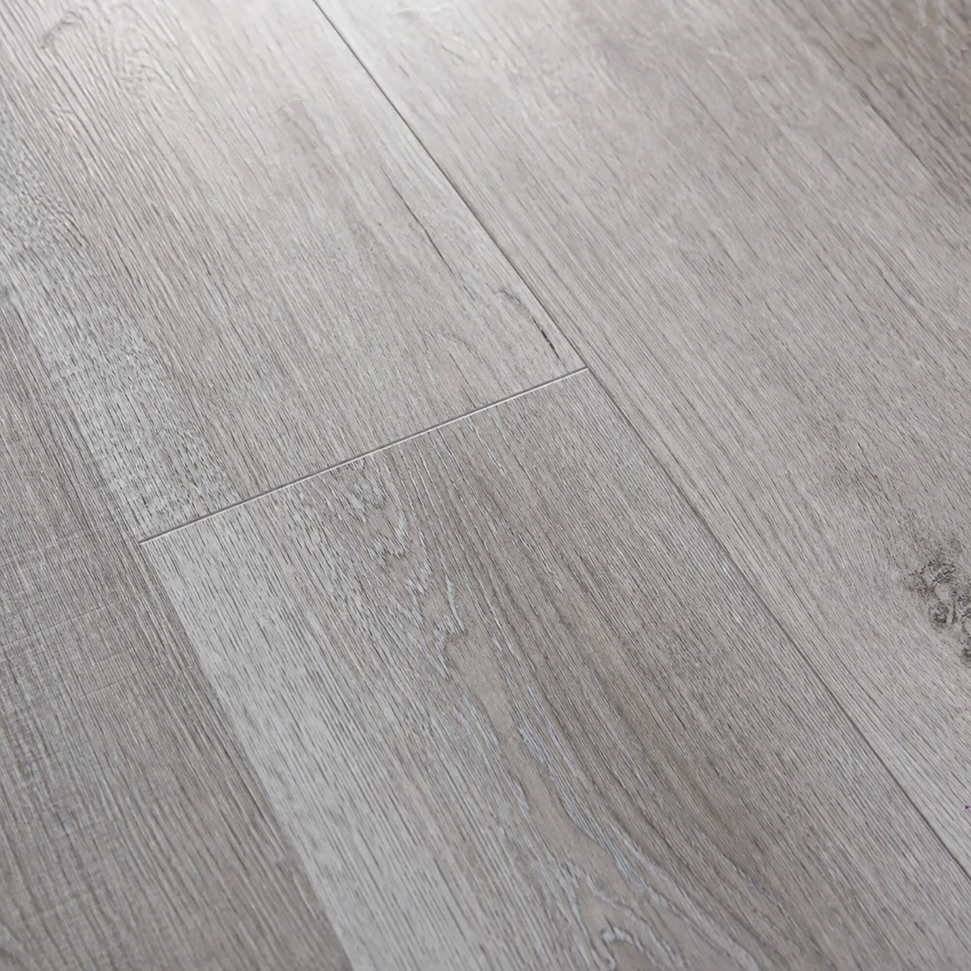 Close-up of gBamburgh Grey rigid LVT plank flooring.