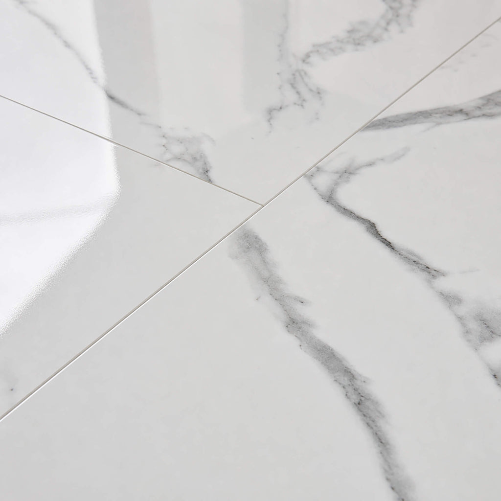 Close-up of Calacatta Marble Gloss Rigid LVT floor tiles.