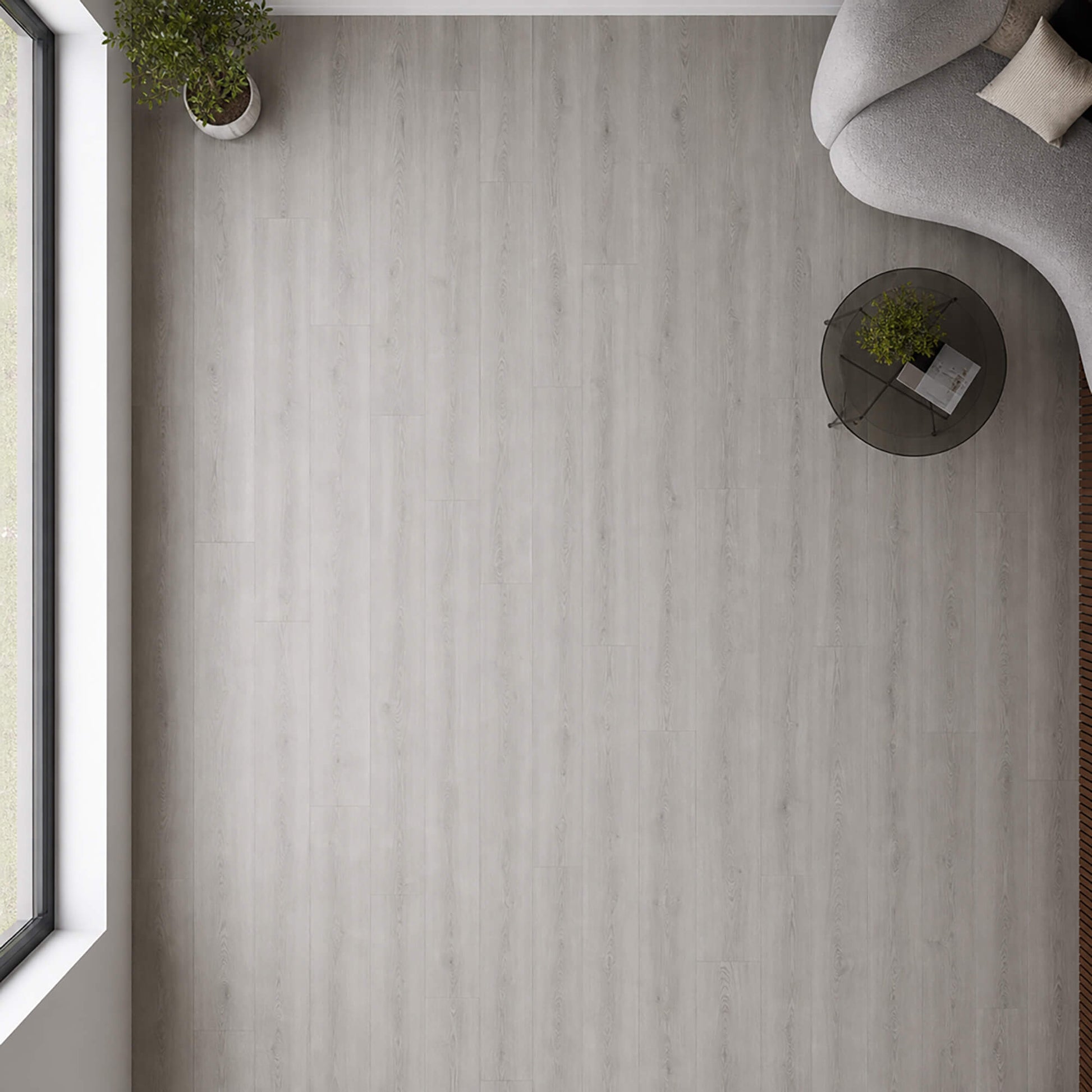 Elevated view of Causeway Grey Essentials laminate flooring in a living room setting.