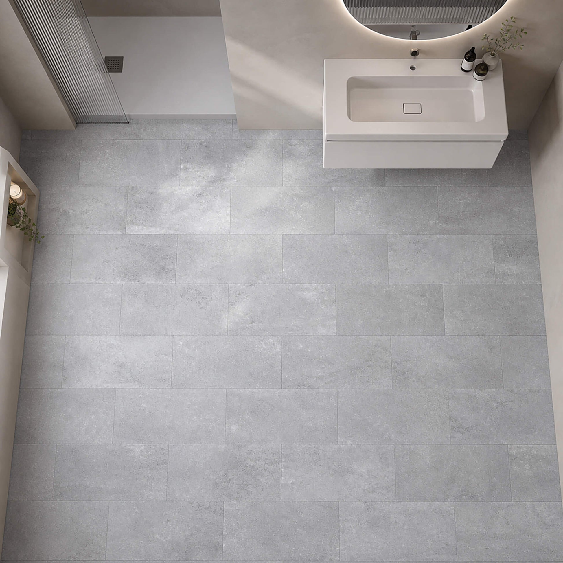 Elevated view of a Claros Grey Rigid LVT tile flooring in a bathroom.