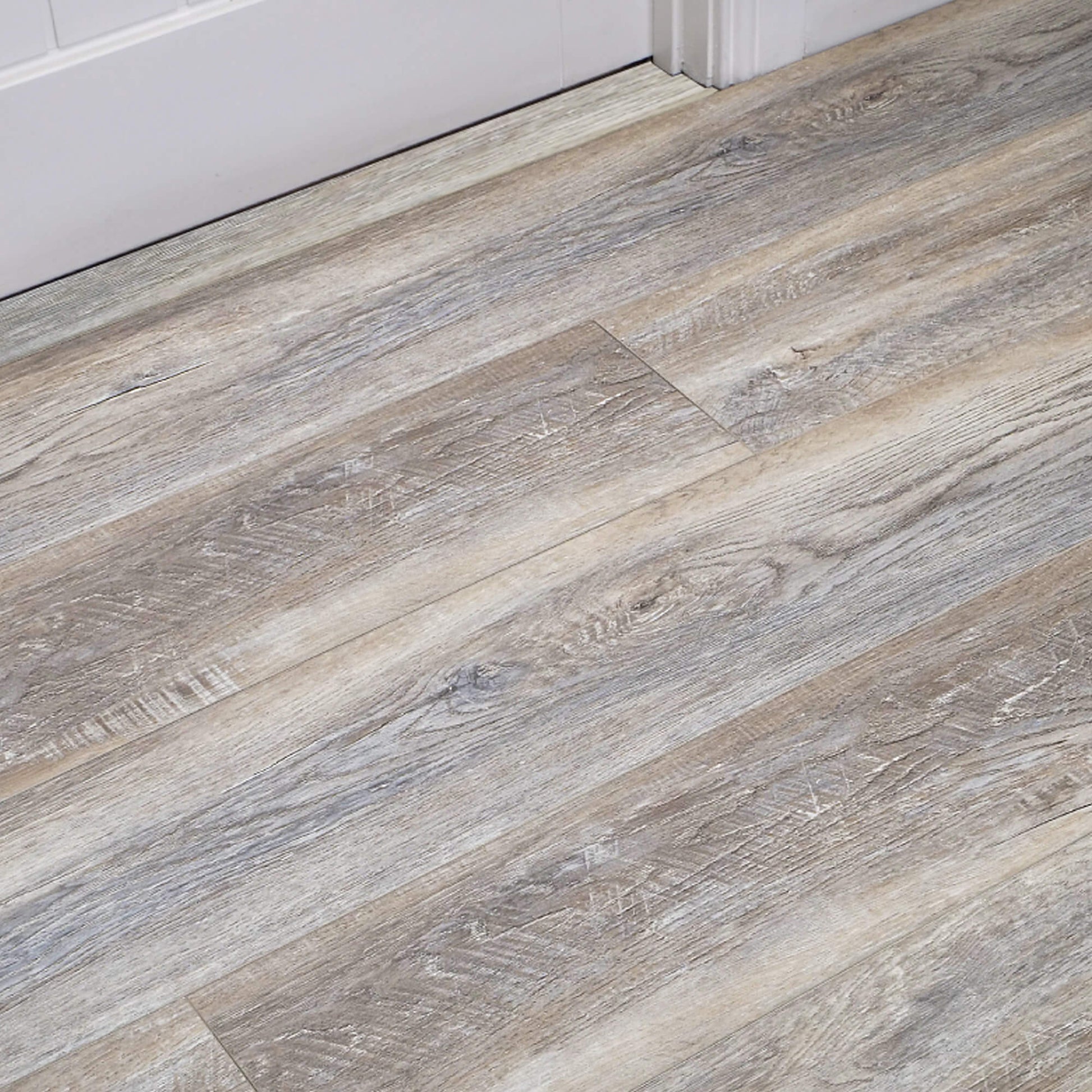 Close-up of Driftwood Oak Rigid LVT flooring in an internal setting.
