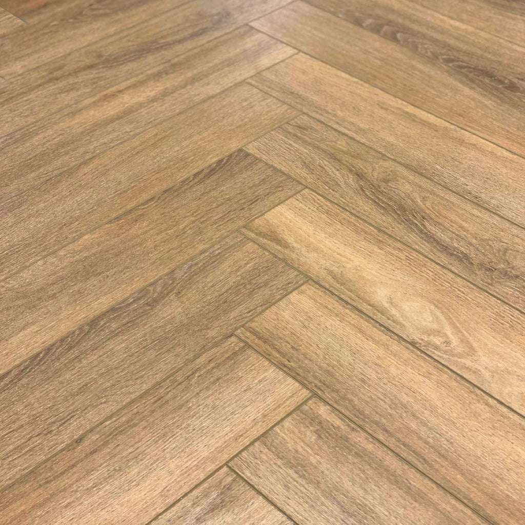 Close-up of the Forest Oak Rigid LVT Herringbone flooring grain