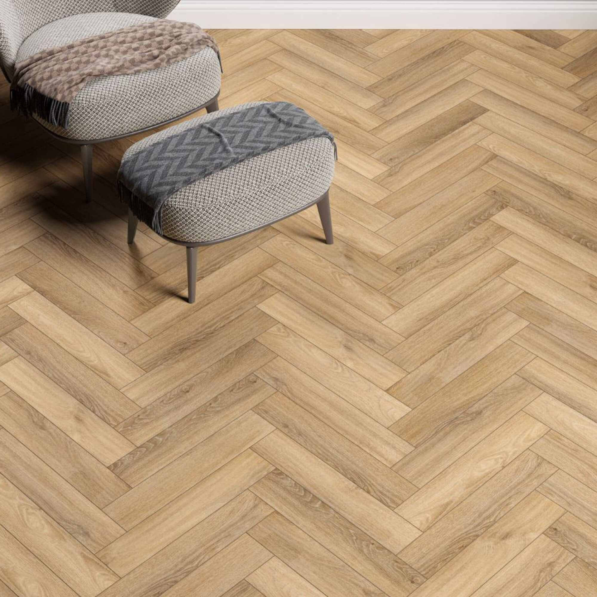 Forest Oak Rigid LVT Herringbone Flooring with a herringbone pattern and a small ottoman in the foreground.