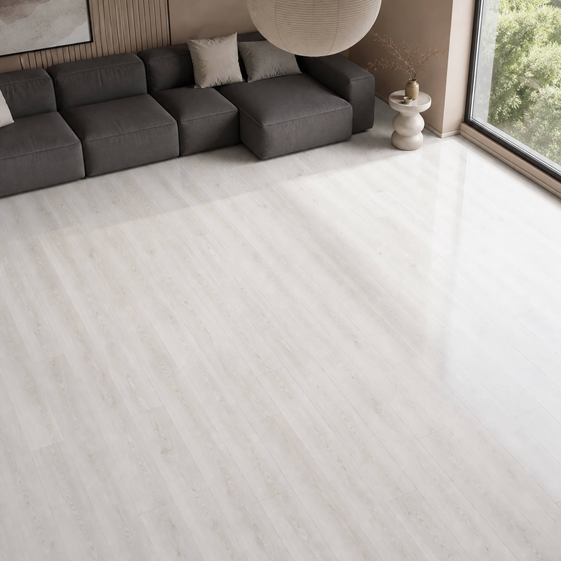 Close-up of Fresco Snow Gloss laminate flooring in a modern living room setting.