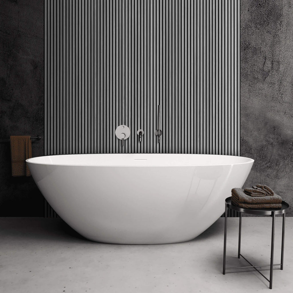 Modern white freestanding bathtub in a bathroom with Grey Aqua Slatwall Panel wall and towel.