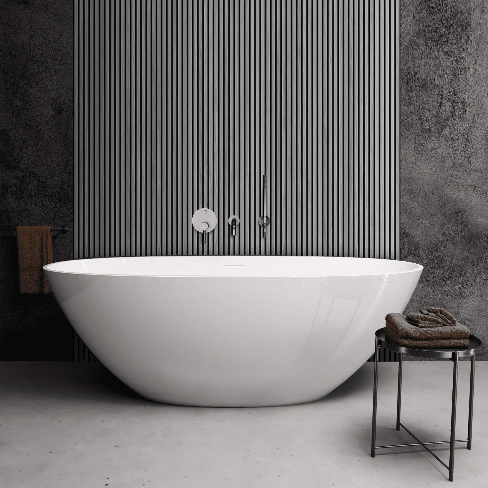 Modern white freestanding bathtub in a bathroom with Grey Aqua Slatwall Panel wall and towel.