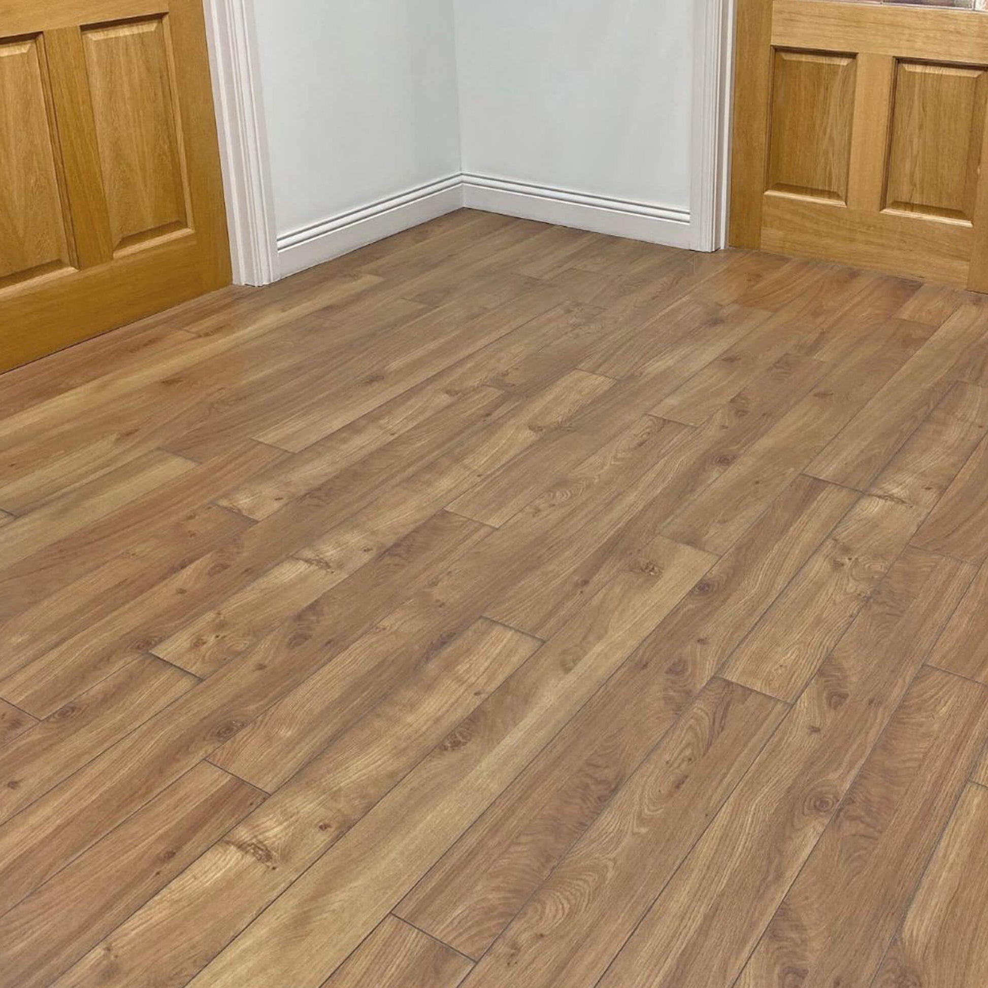 Groovy Oak Prestige Laminate Flooring in a home hallway setting.