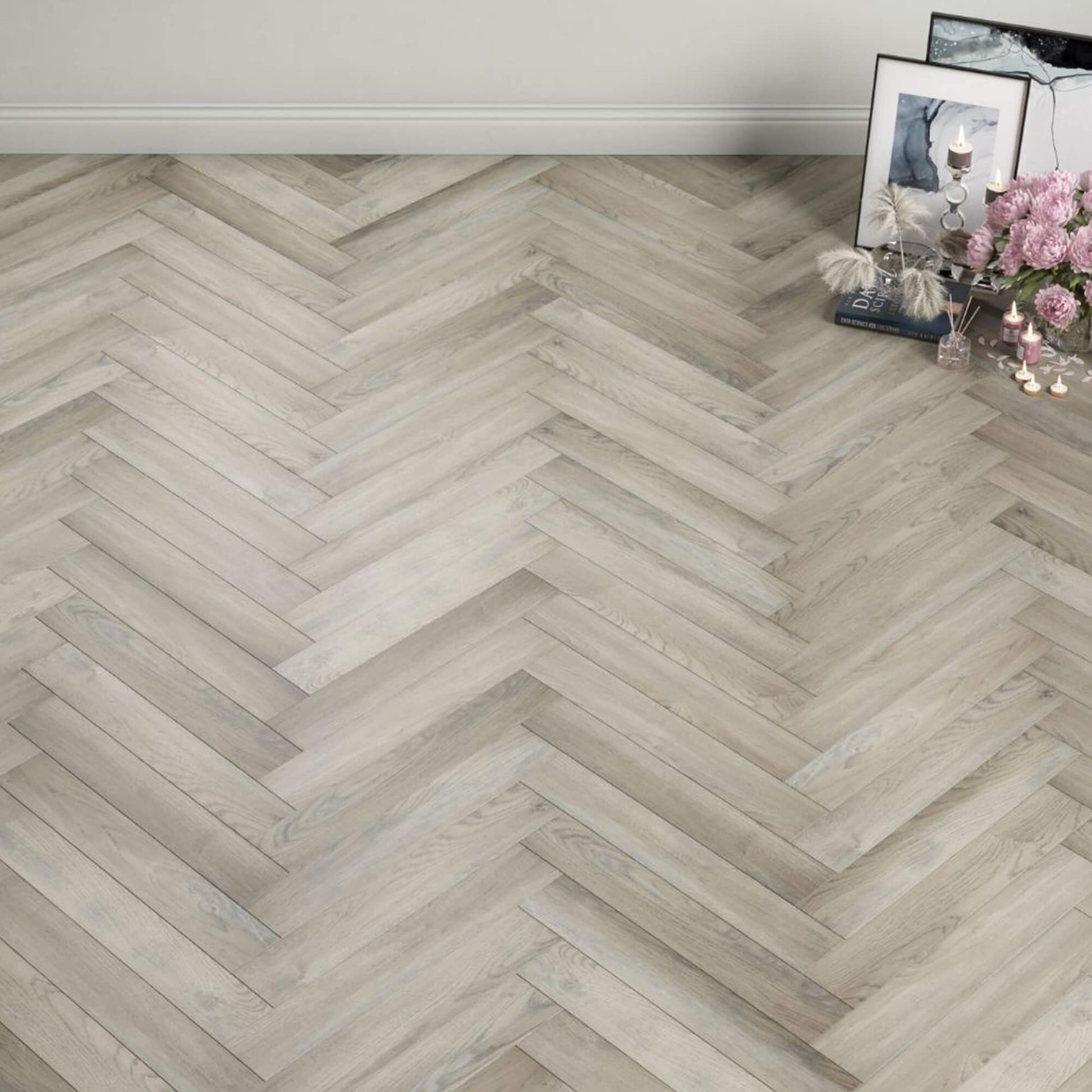 Manor Grey Oak Herringbone Laminate Flooring in a home living room interior setting.