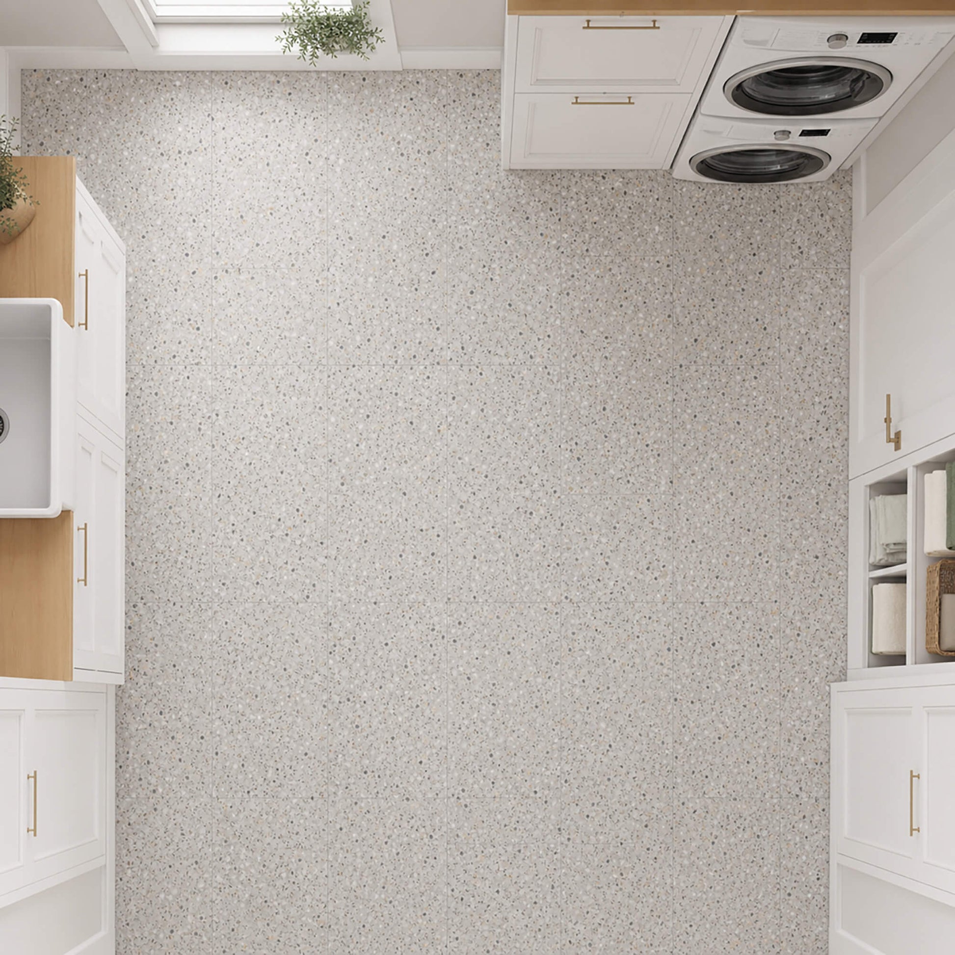 Elevated view of Close-up of Milano Terrazzo Rigid LVT floor tiles in a utility room setting.