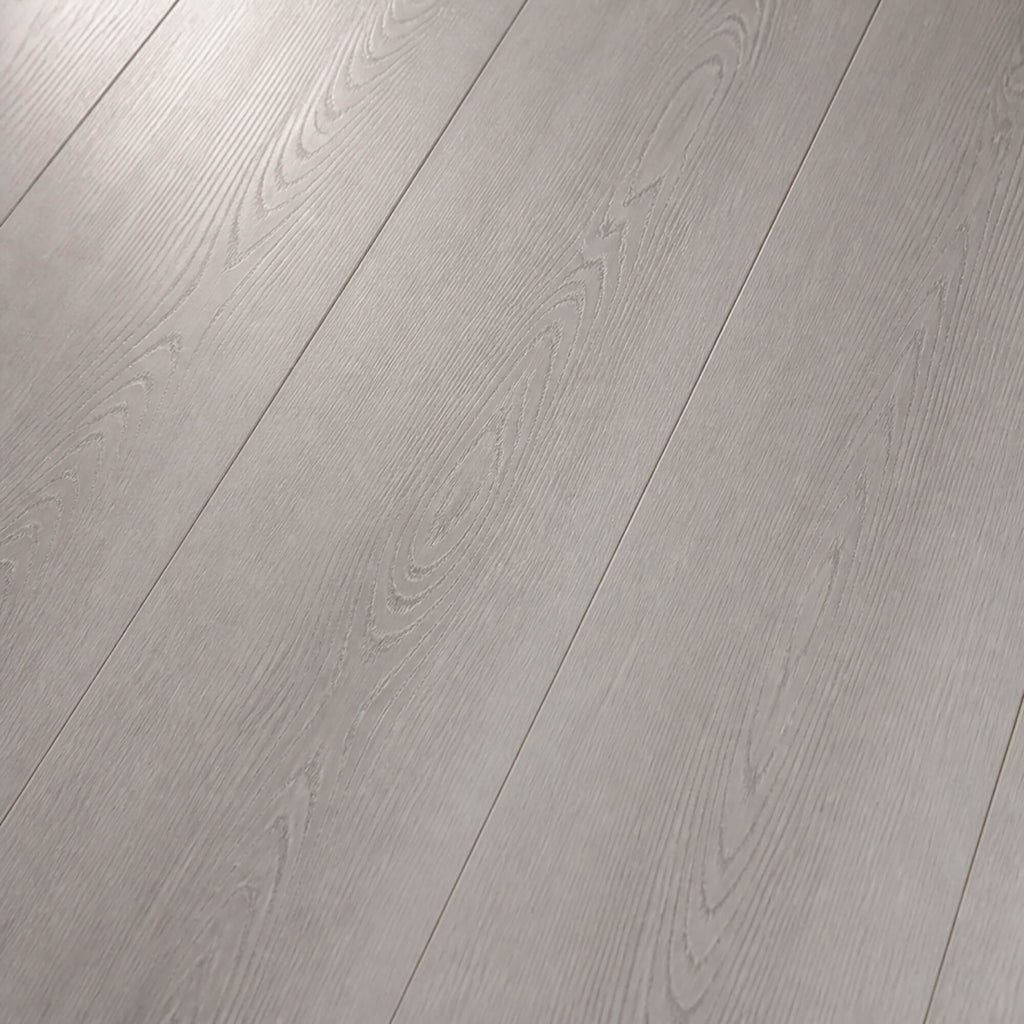 Close-up showing the grain and texture of Misty Grey Prestige Plus laminate flooring.