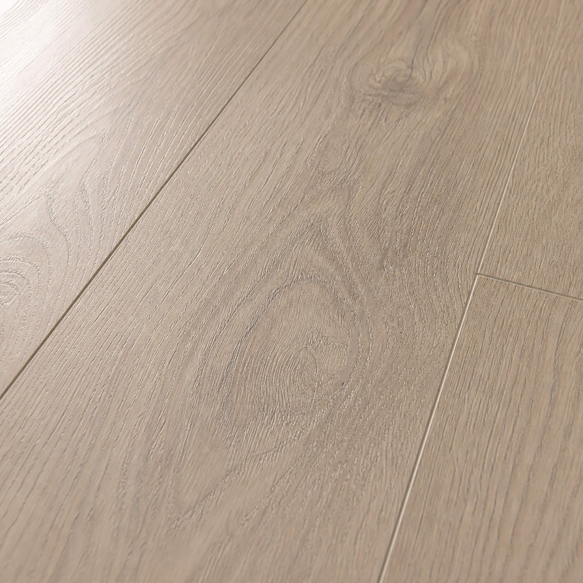 Close-up of the grain and texture of Mushroom Carpenter Oak laminate flooring.