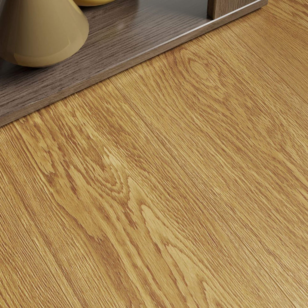 Close-up of Natural Oak Country Laminate Flooring with the edge of a side table in the corner.