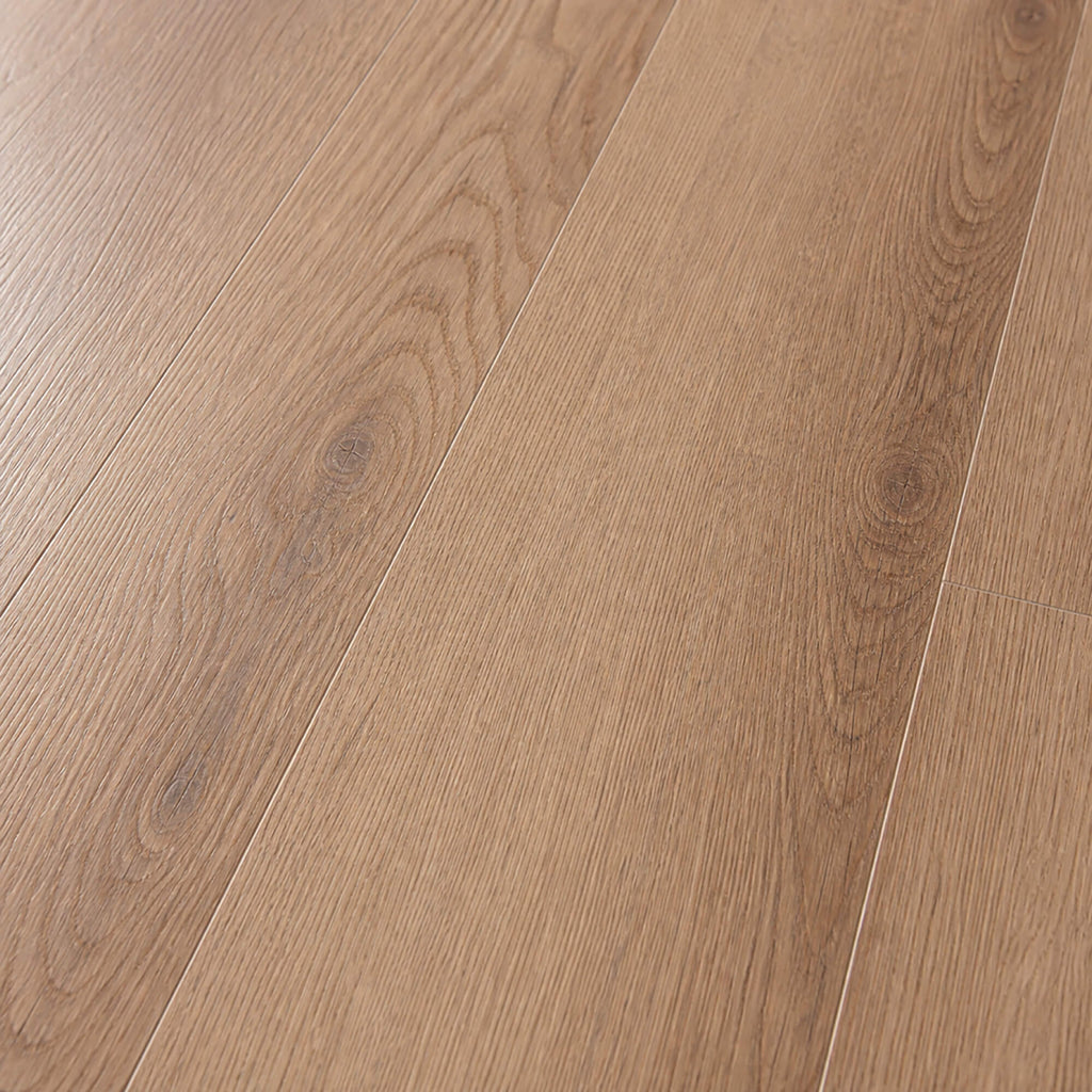 Close-up of New England Oak Rigid LVT plank flooring with a natural finish.