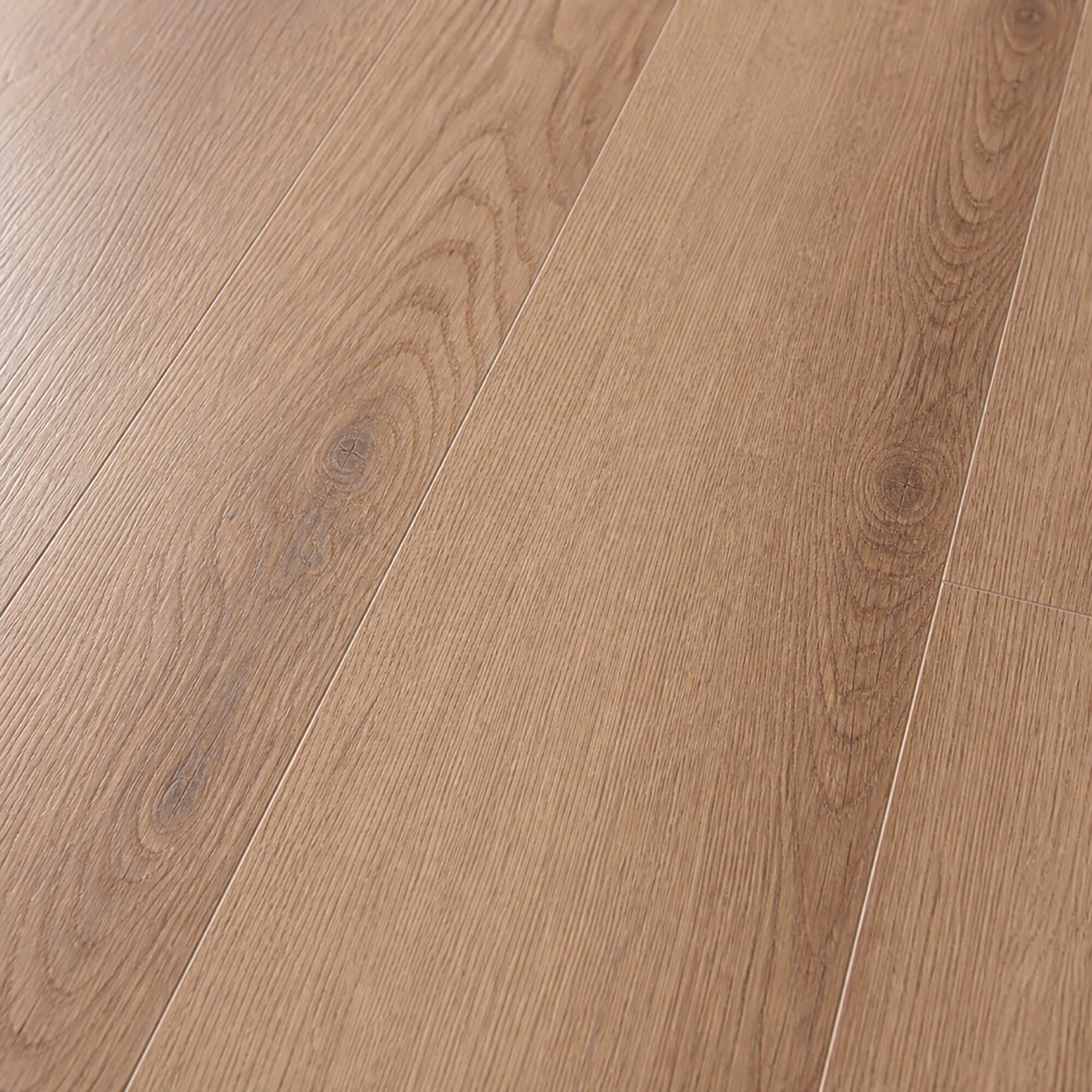 Close-up of New England Oak Rigid LVT plank flooring with a natural finish.