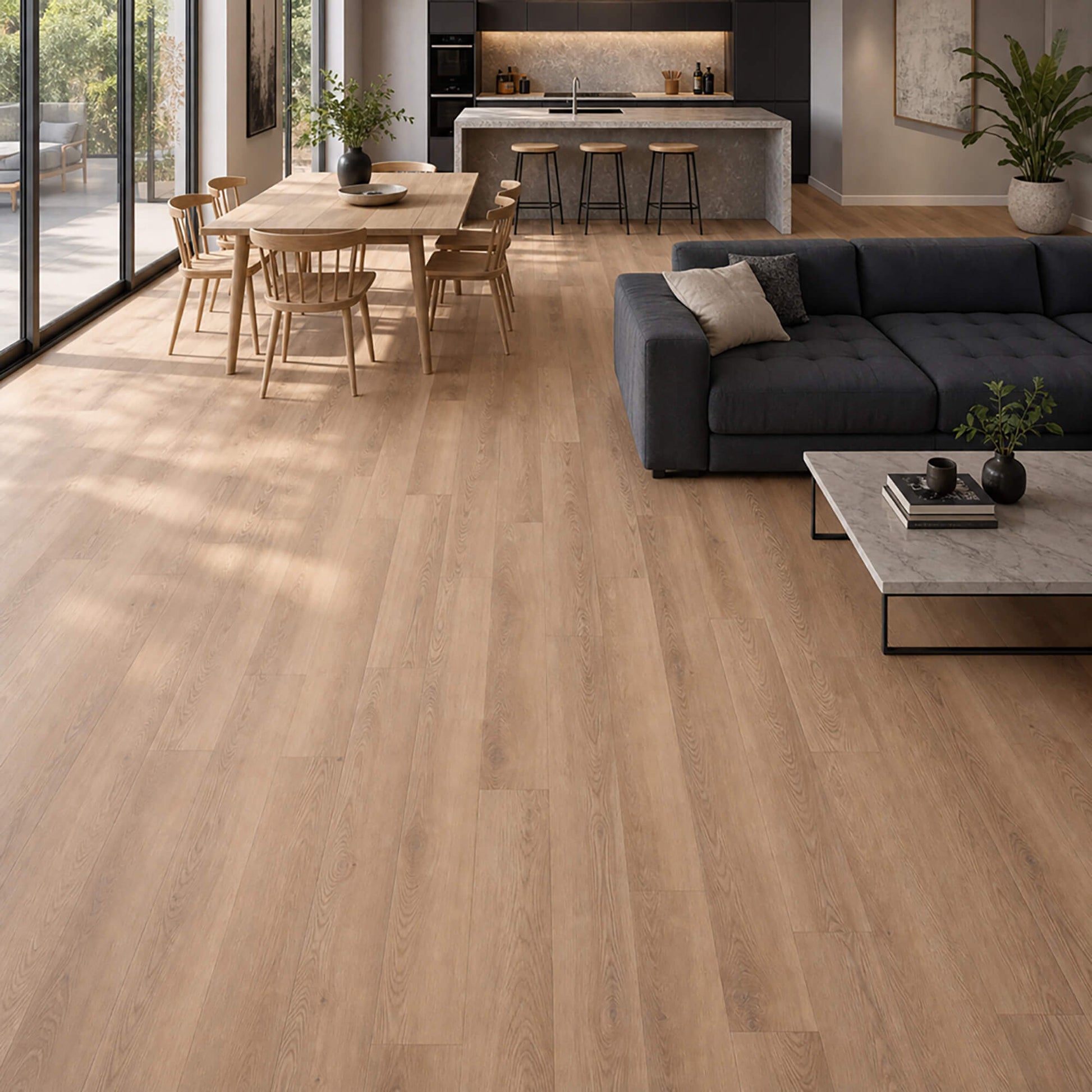 Modern living room with a greyl sofa, dining table, kitchen area and New England Oak rigid LVT flooring.