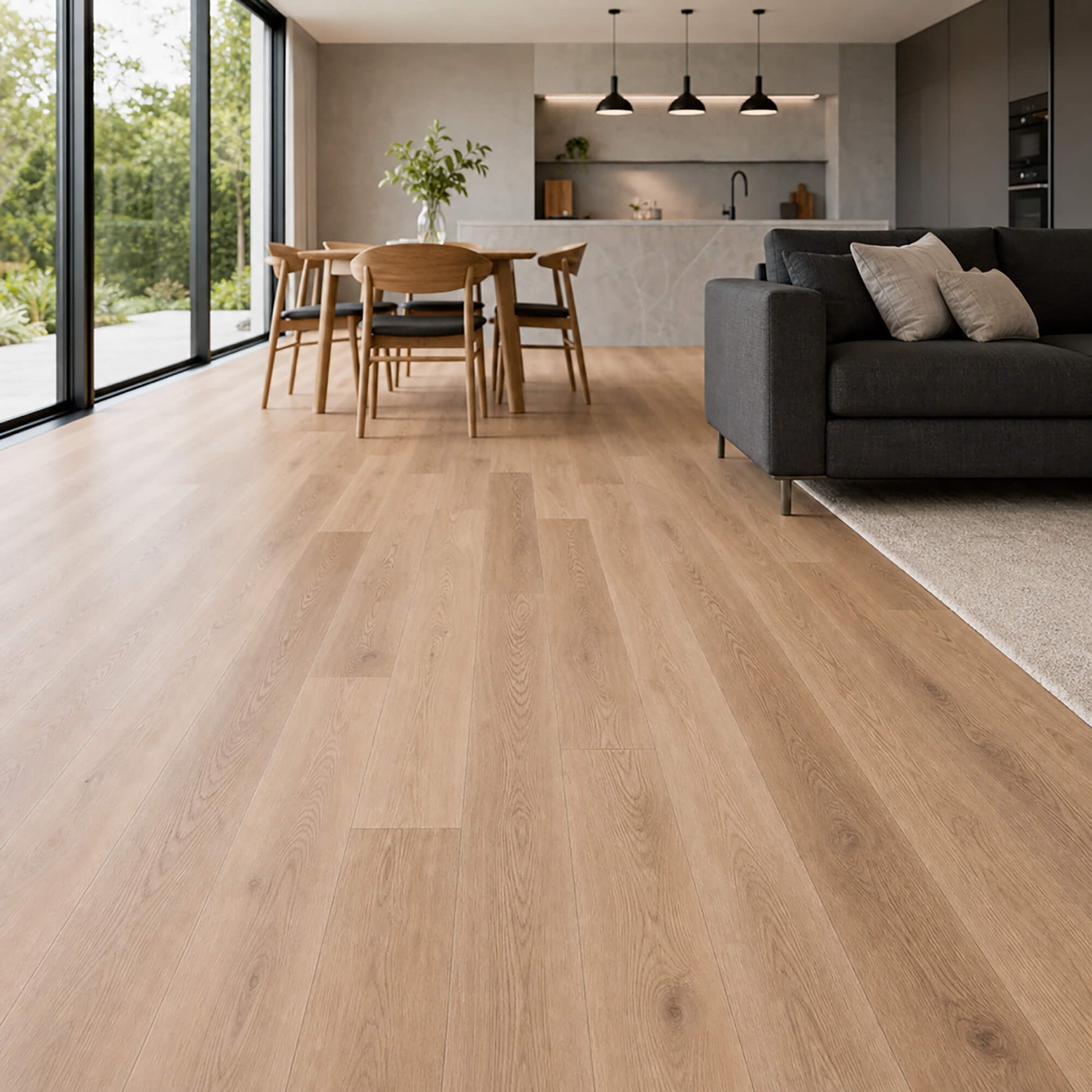 New England Oak rigid LVT flooring in a modern living room setting with a kitchen area in the background.