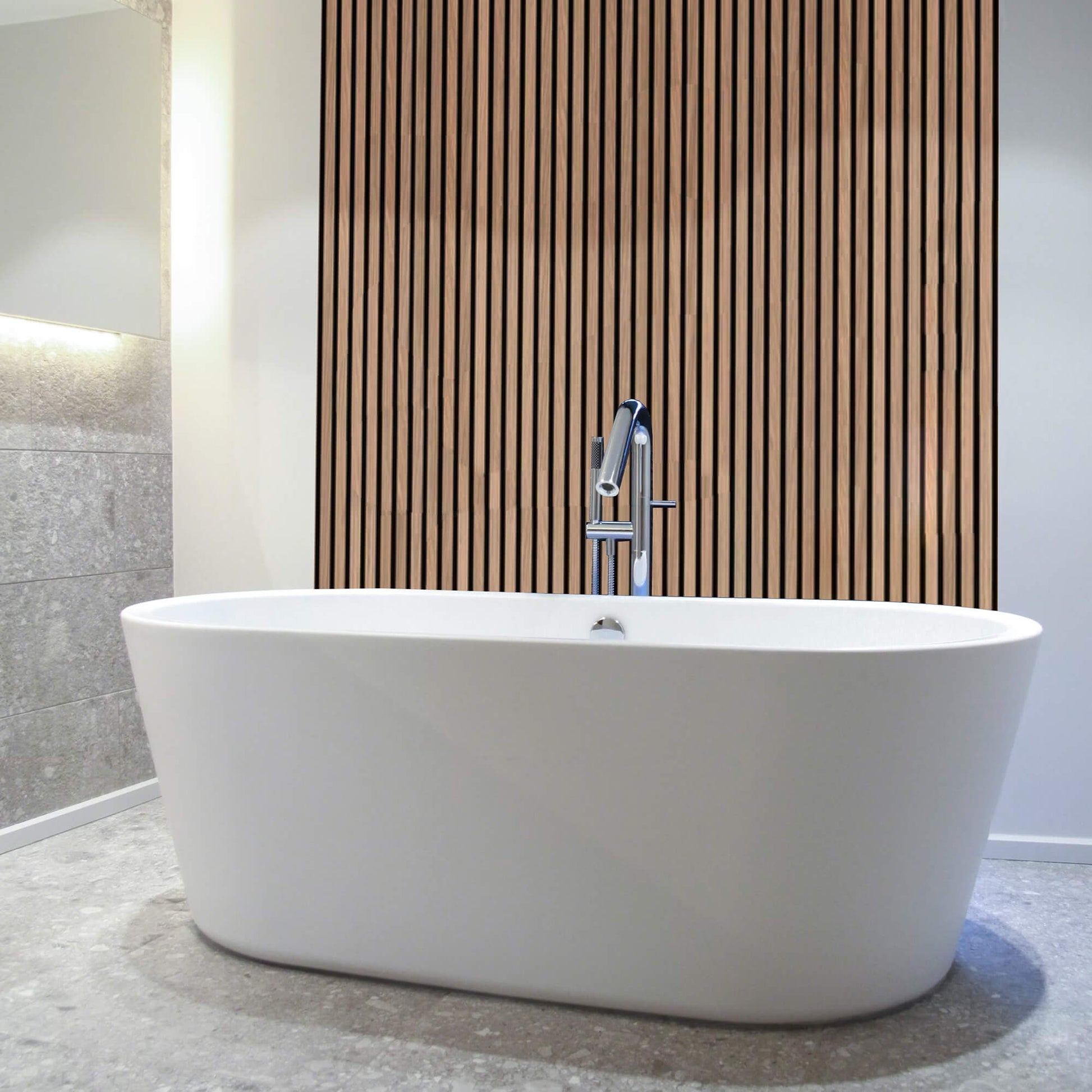 White freestanding bathtub in a modern bathroom with Oak Aqua Slatwall Panelling.