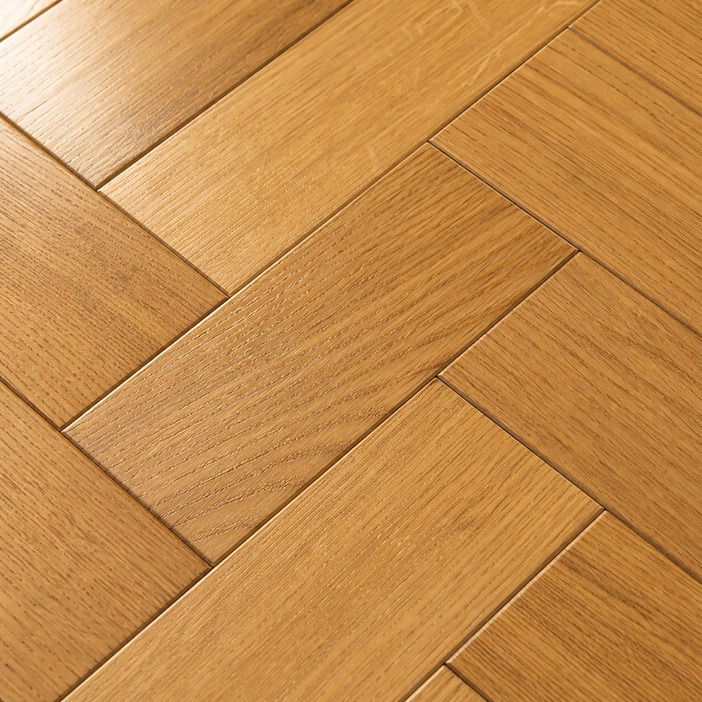 Close-up of Natural Oak Herringbone Lacquered 90mm engineered wood flooring.