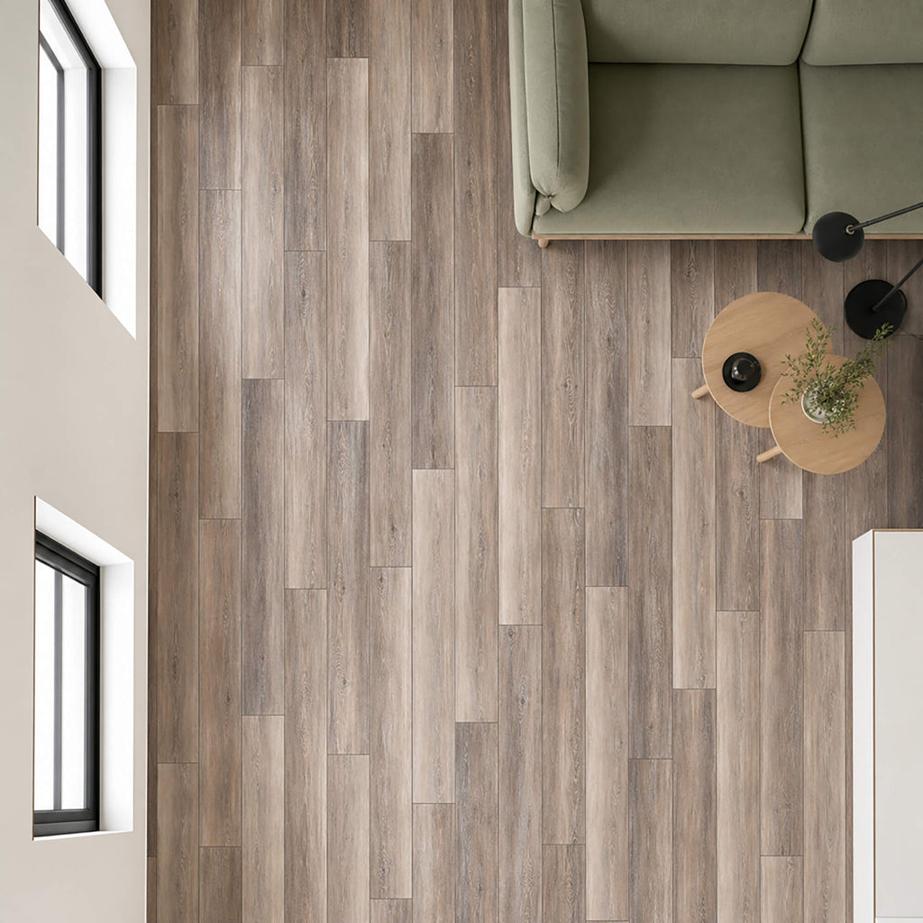 Elevated view of Portland Oak Rigid LVT flooring in a living room apartment setting.