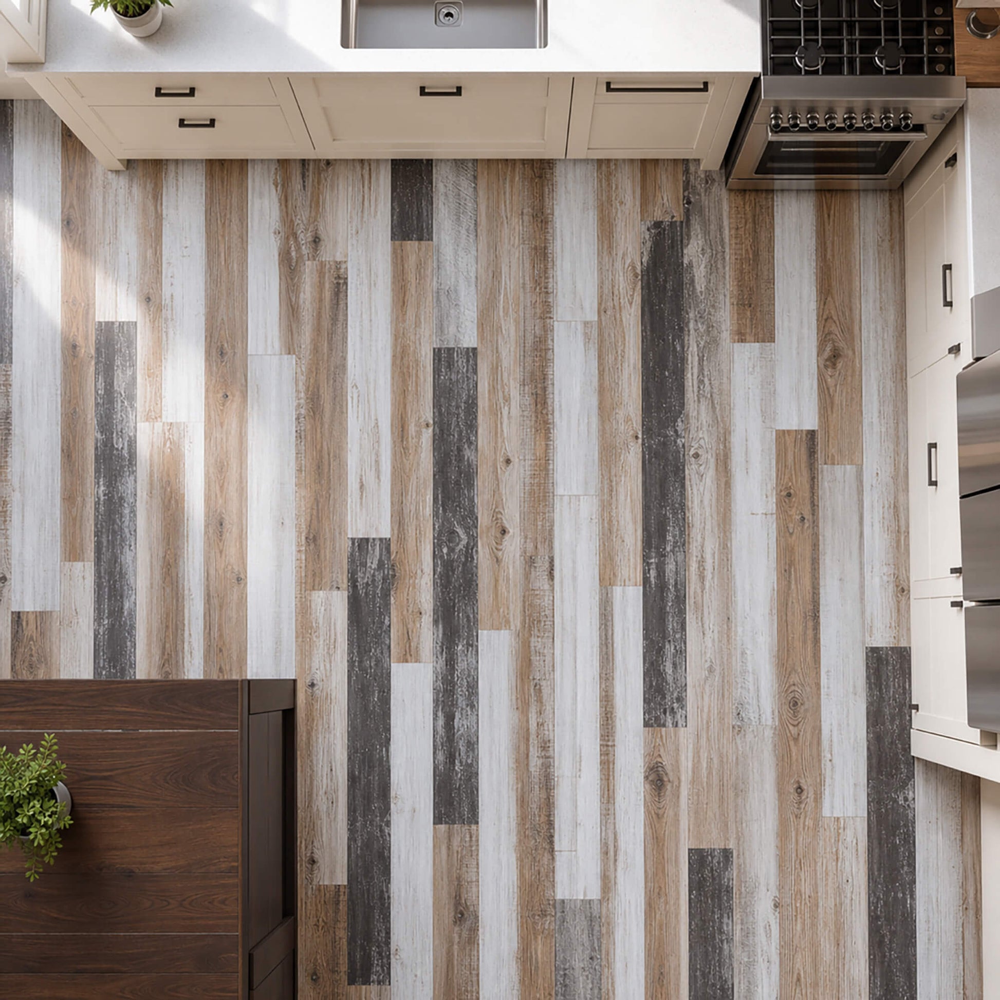 Elevated view of Reclaimed Oak rigid LVT plank flooring in a modern home kitchen setting.