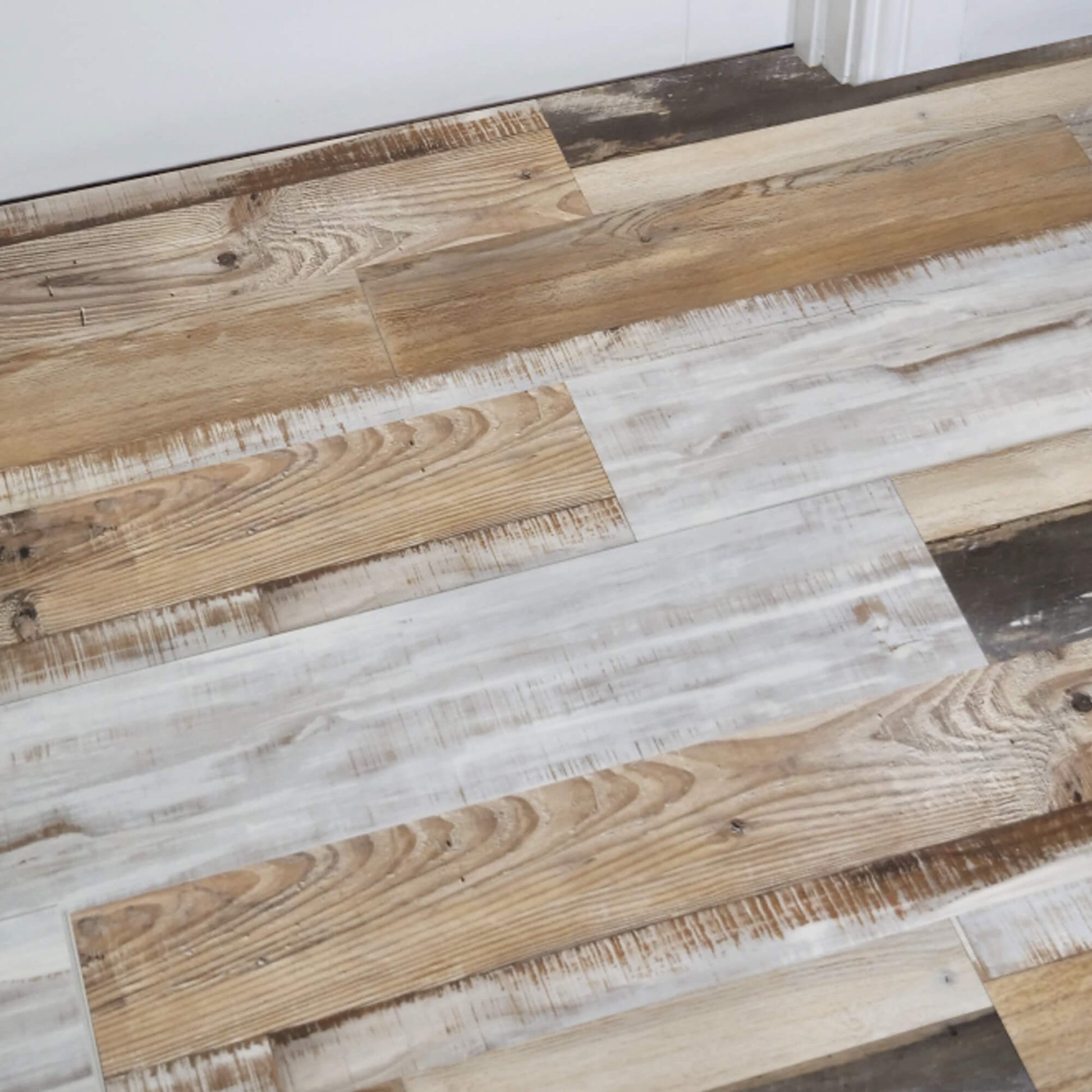 Reclaimed Oak Rigid LVT Flooring with a mix of brown and gray planks.