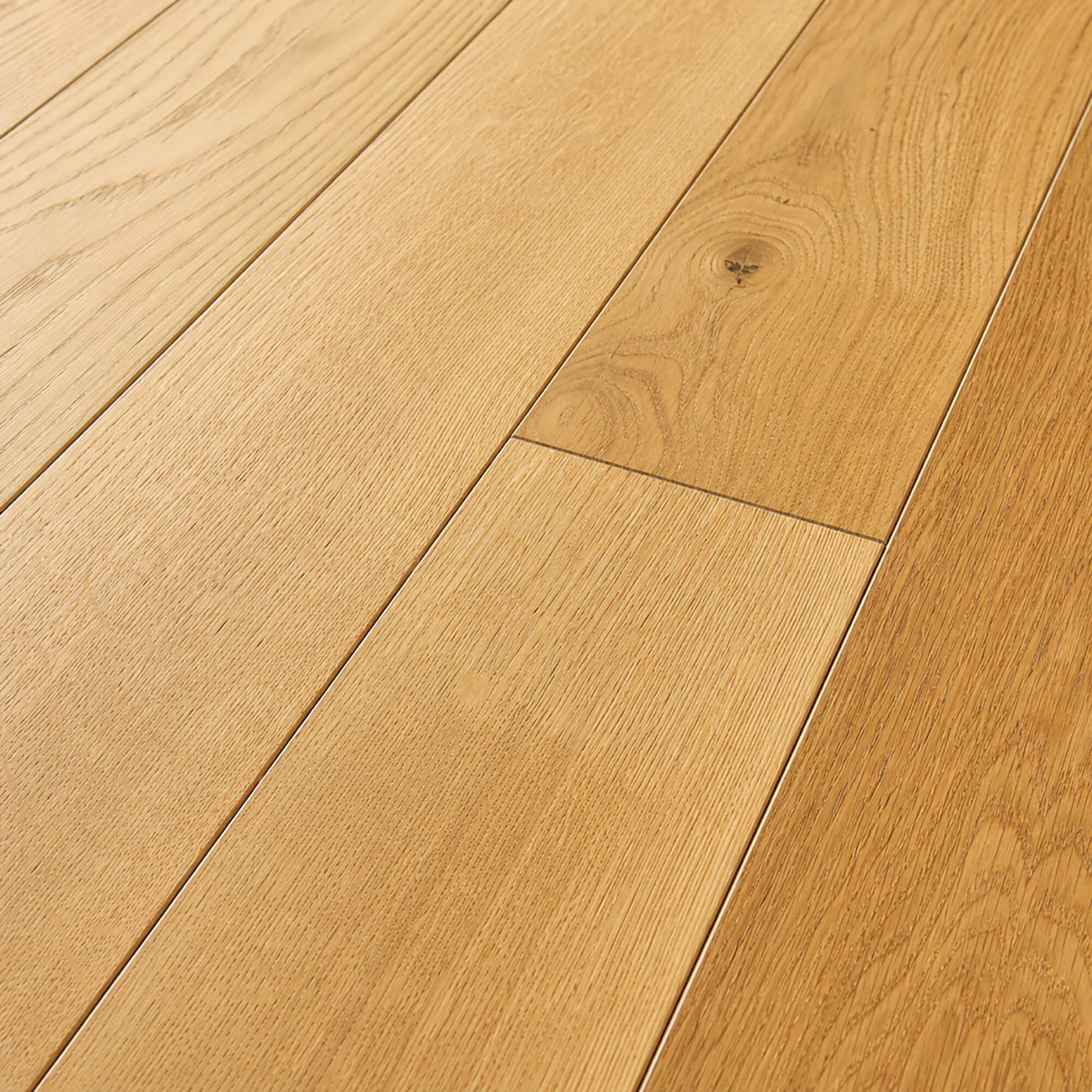 Close-up of a Rustic Oak Lacquered 90mm engineered wooden floor with visible grain and texture.