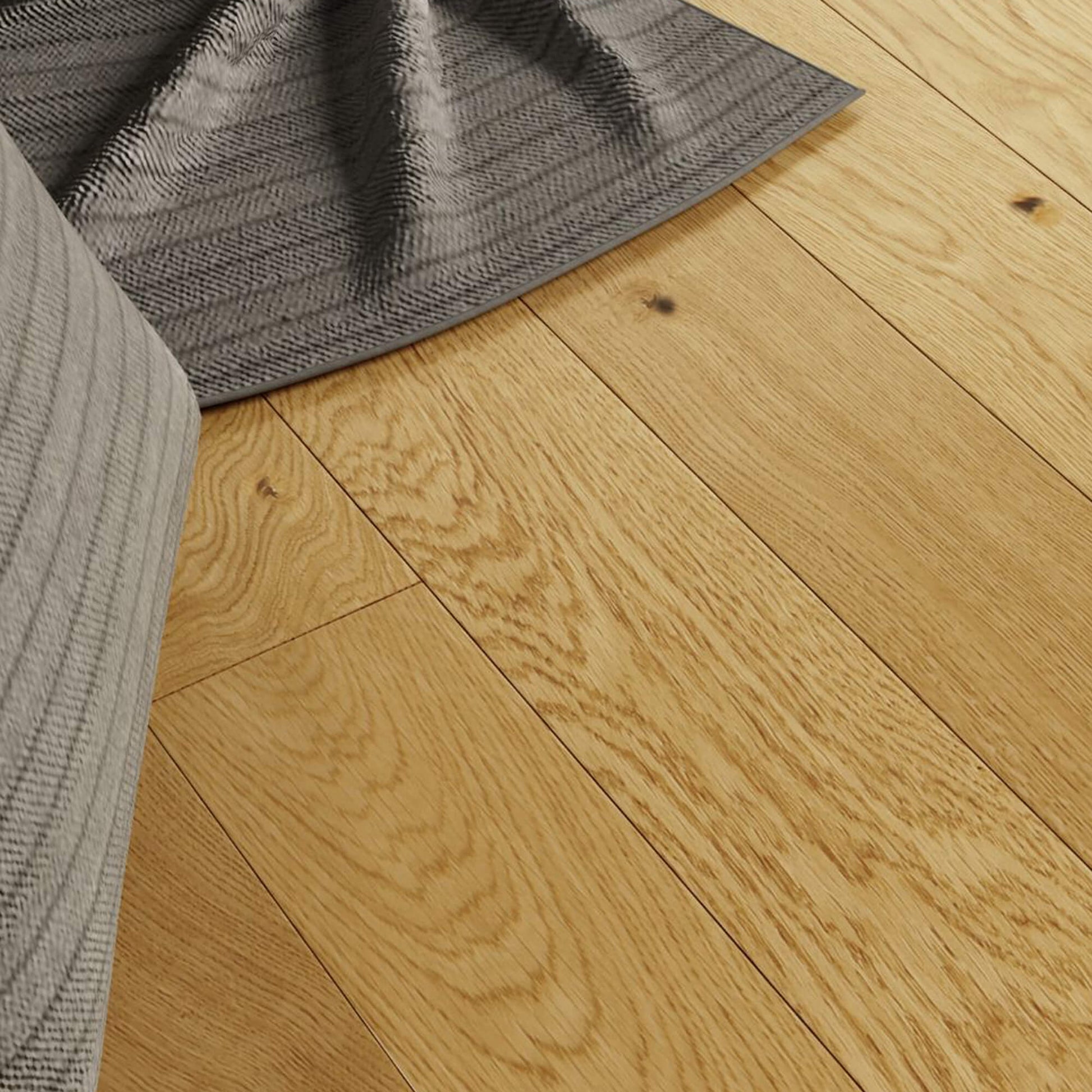 Close-up of Rustic Oak Lacquered 125mm Engineered Wood Flooring with a grey rug and fabric.