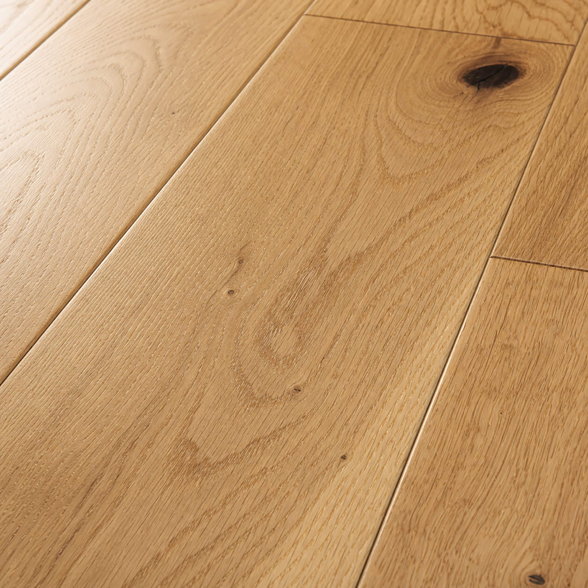 Close-up of Rustic Oak Lacquered 125mm engineered wood flooring with visible grain and texture.