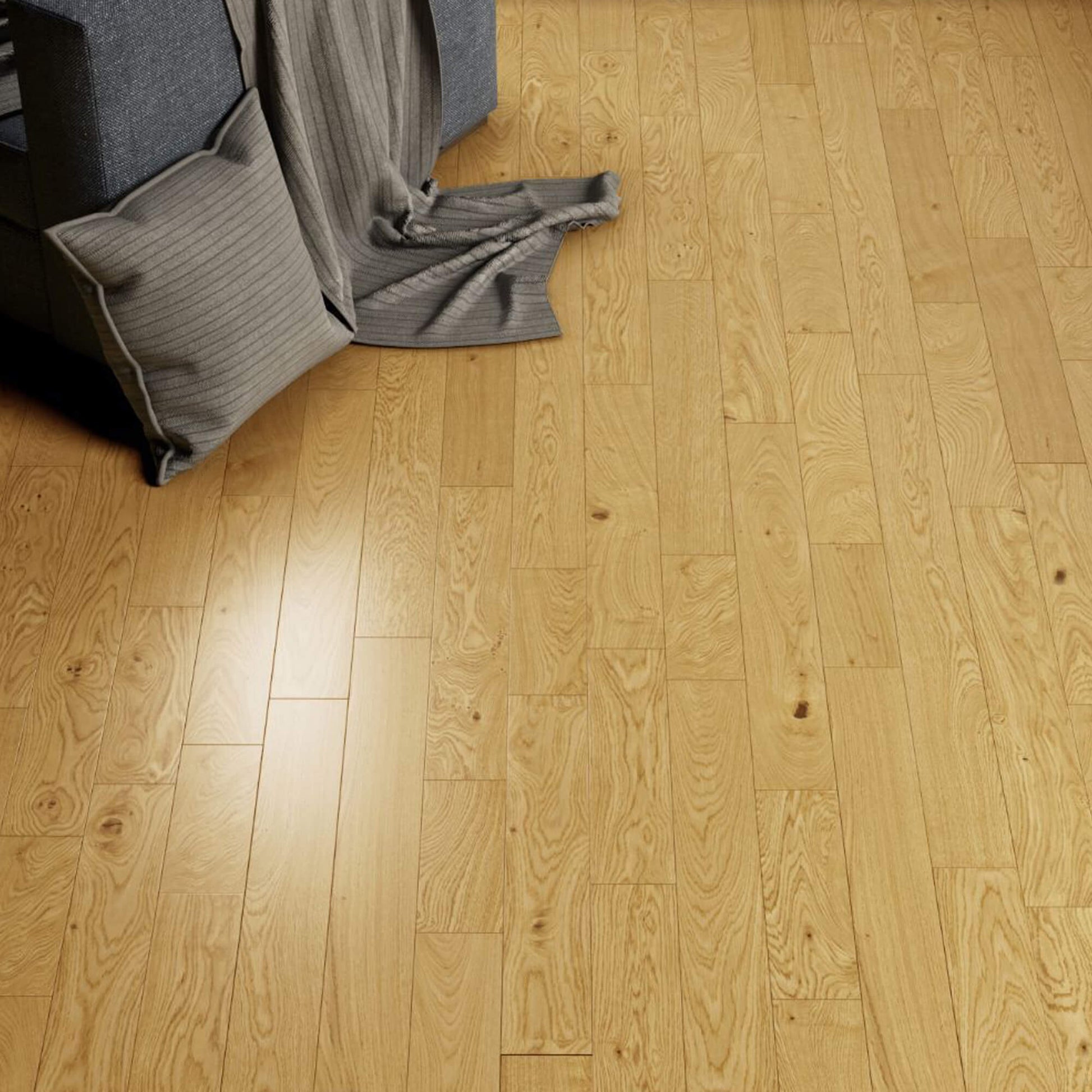 Rustic Oak Lacquered 125mm Engineered Wood Flooring with a grey couch and pillow in the corner