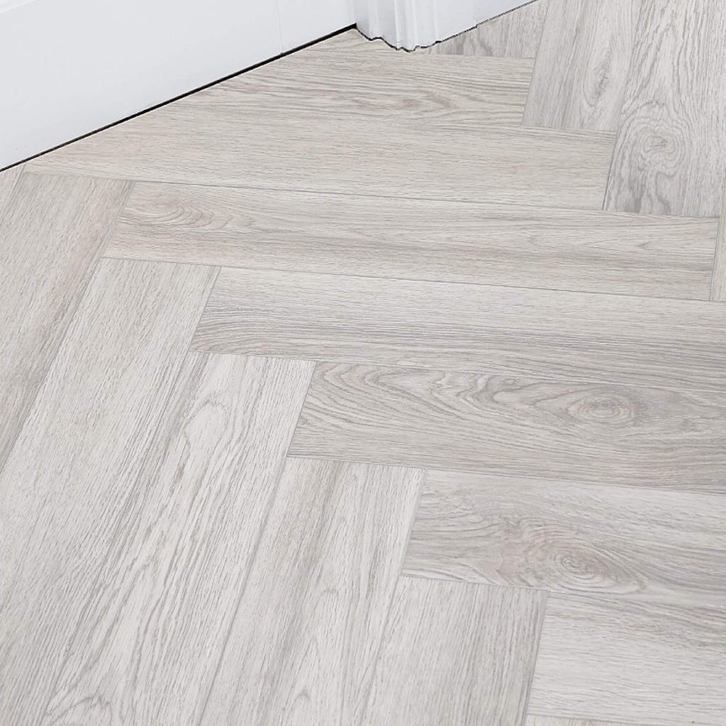 Siberian Oak Rigid LVT Herringbone Flooring in a room setting