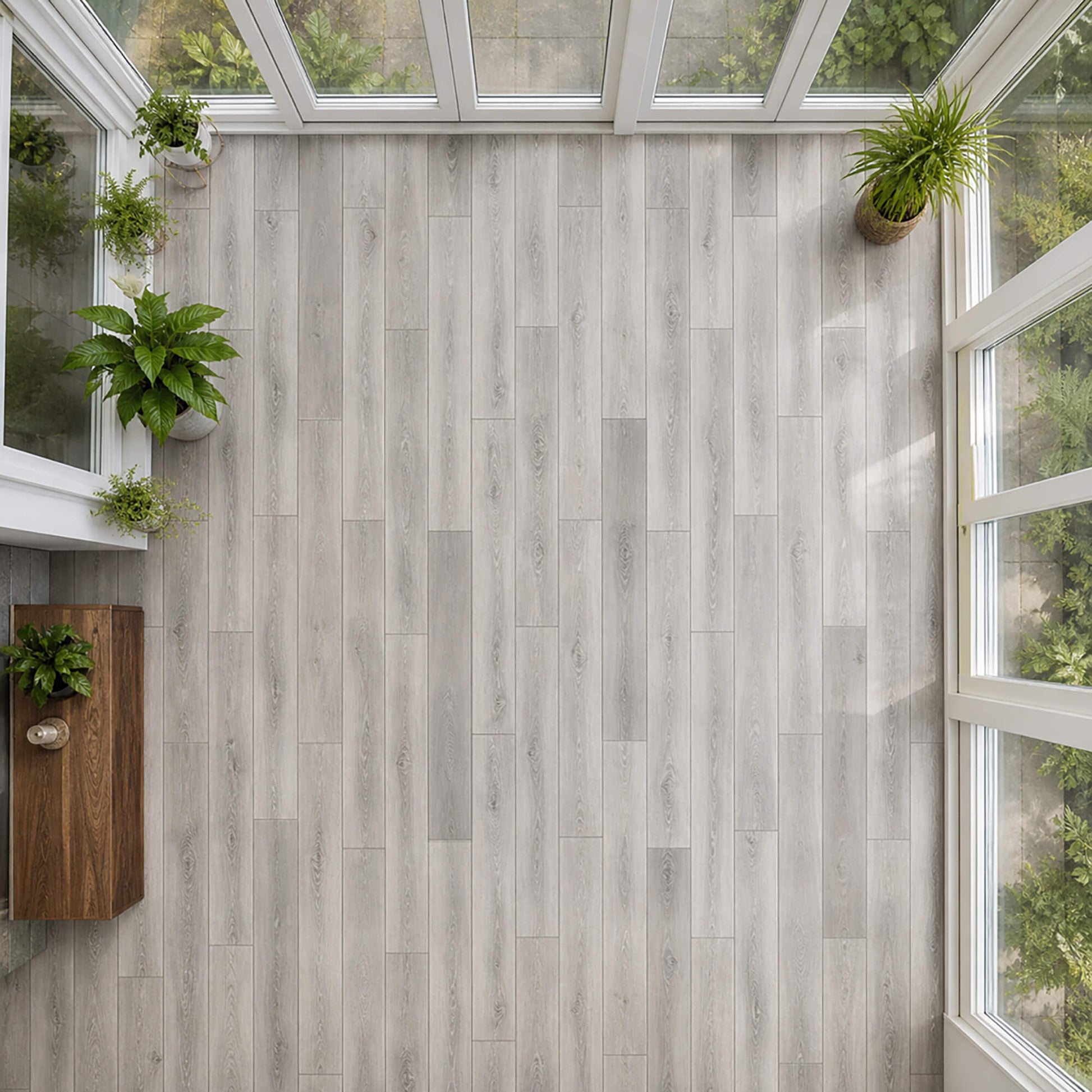 Elevated view of Silver Grey Oak Prestige laminate flooring in a conservatory setting.