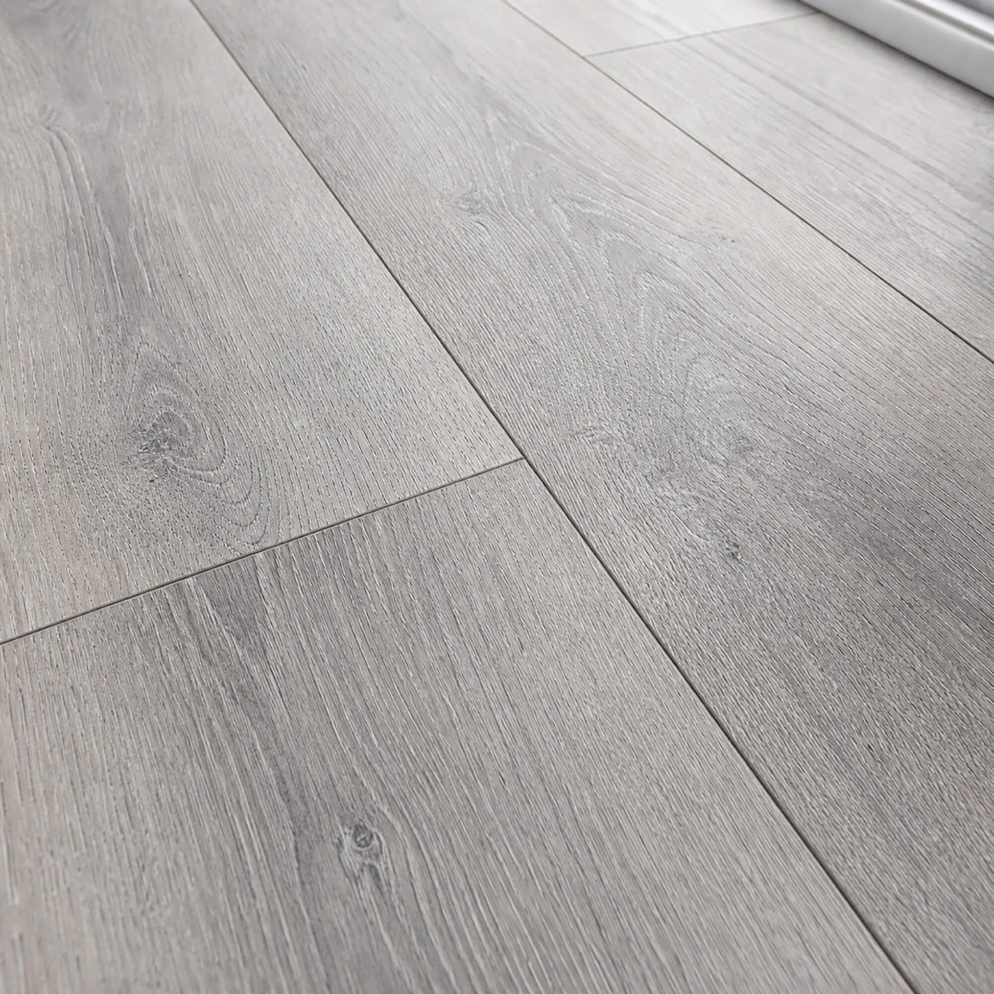 Close-up of the grain and texture of Silver Grey Oak Prestige laminate flooring.
