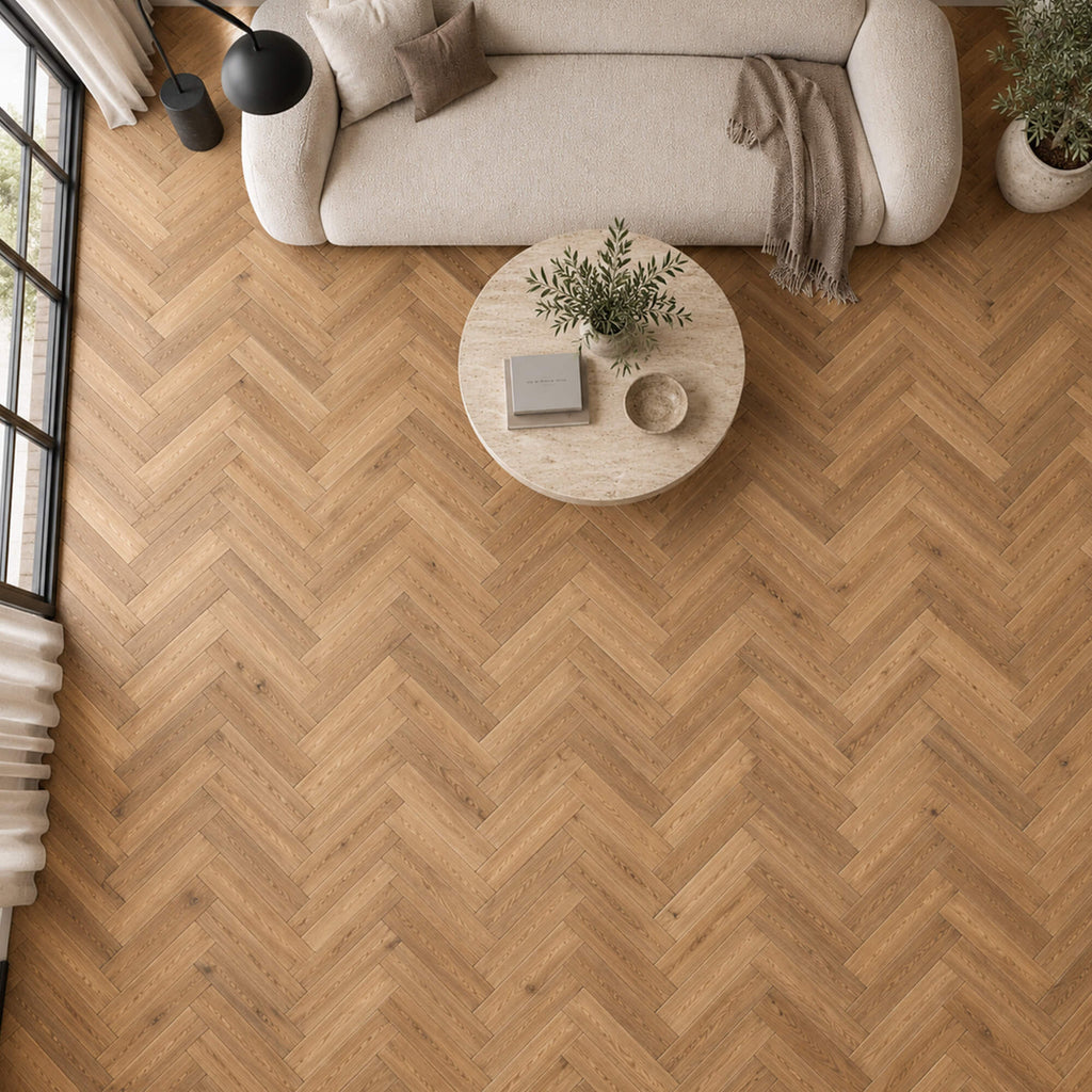 Elevated view of Smoked Oak Herringbone matt lacquered engineered wood flooring in a modern living room setting.