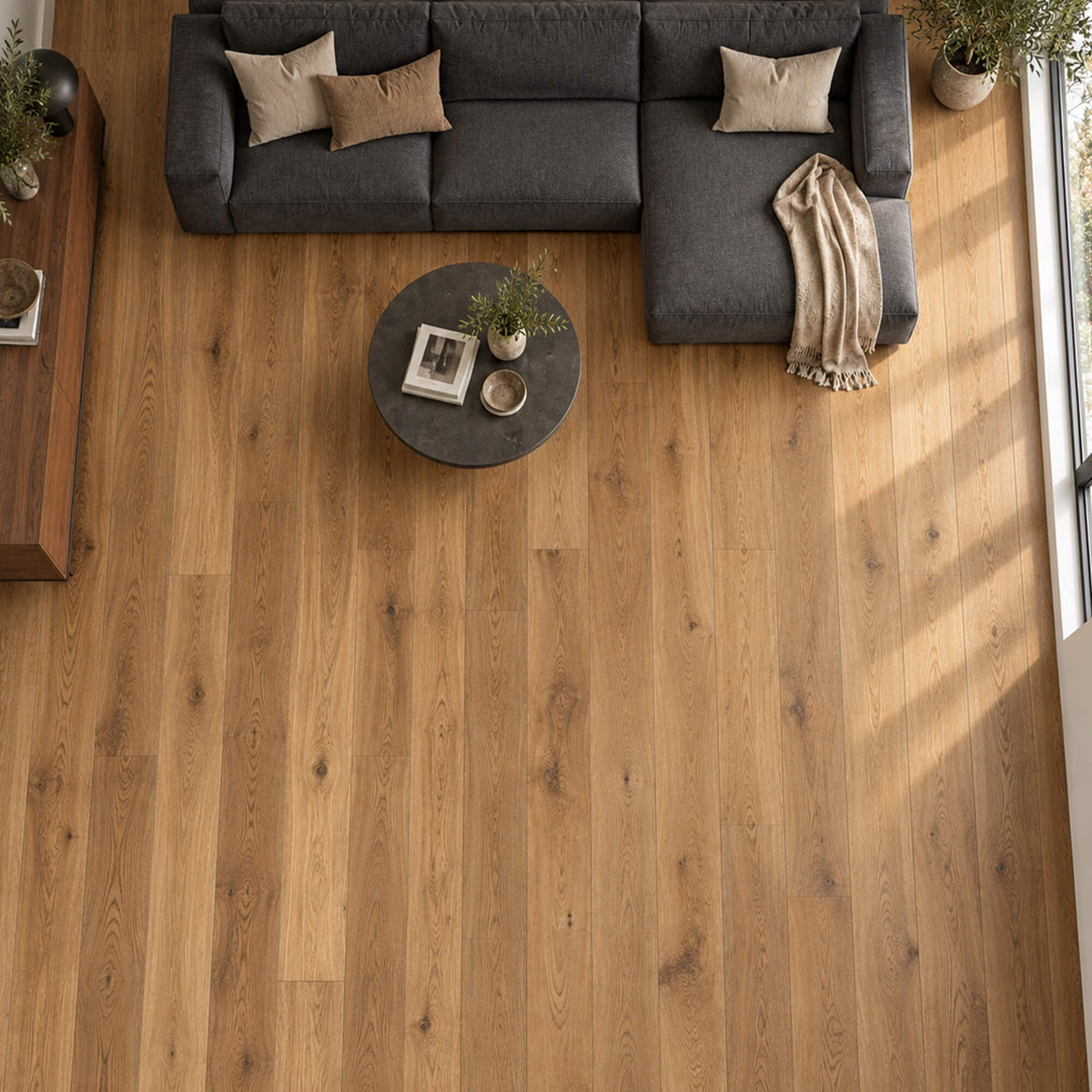 Elevated view of Smoked Oak matt lacquered engineered wood plank flooring  in a living room setting.