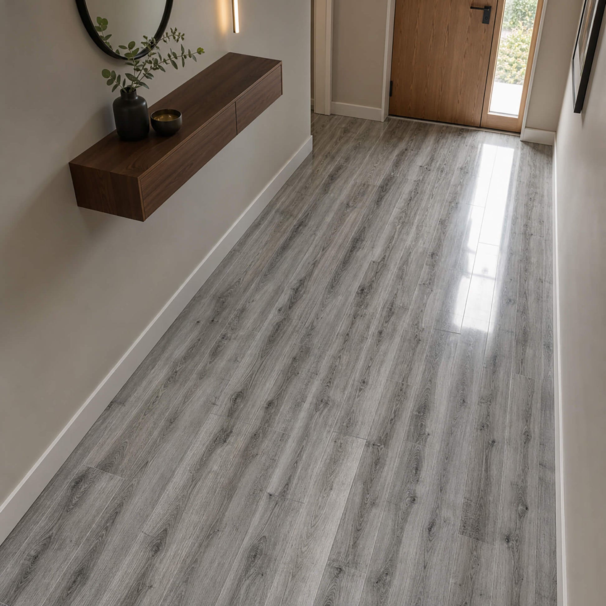 Uptown Oak Gloss laminate flooring in an interior home hallway setting.