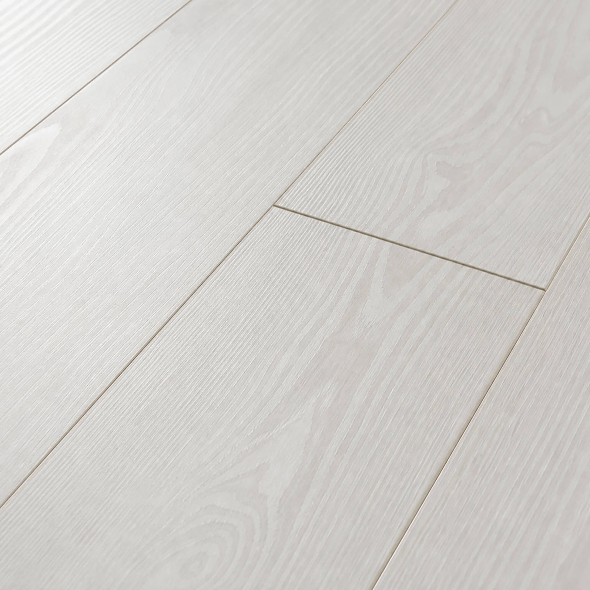 Close-up of Virgin Scandi laminate flooring with a subtle texture.