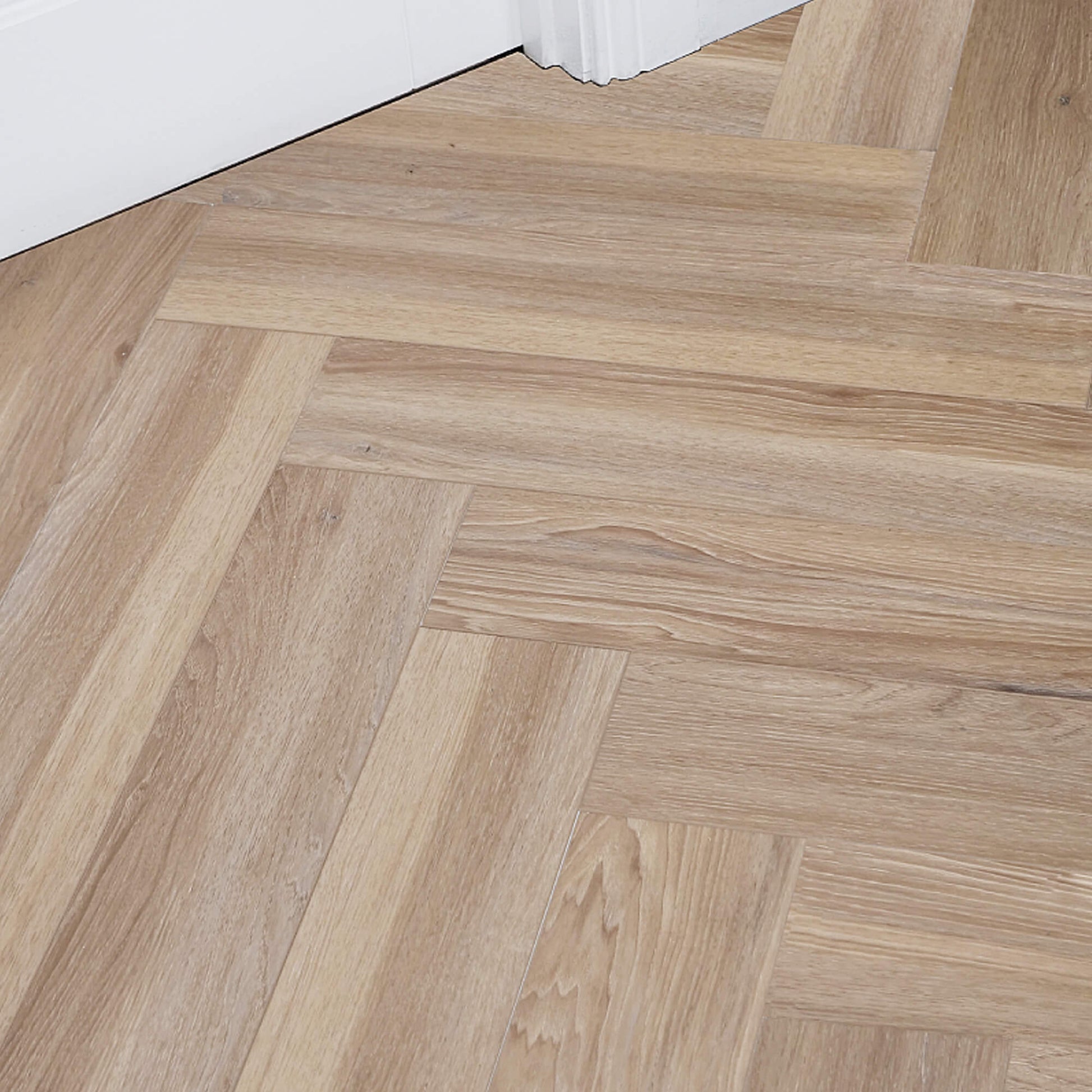 Volcanic Larch Rigid LVT Herringbone Flooring in a room setting