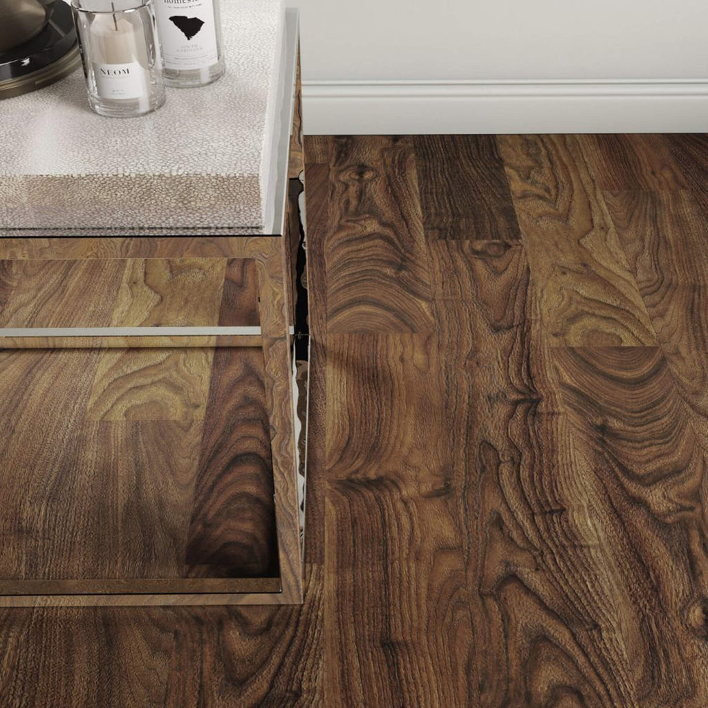 Close-up of Walnut Prestige Laminate Flooring with corner of a table showing