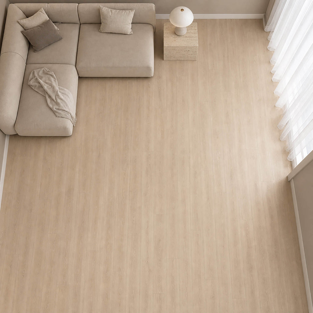Elevated view of Washed Oak Essentials laminate flooring inn a living room setting.